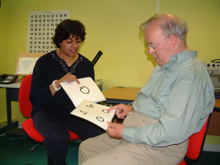 A picture of the person using symbols in an eye examination. Link to Learning Disabilities group